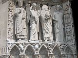 Paris 07 Notre Dame Left Side Saint Denis Holding his Head in his Hands Flanked By Angels